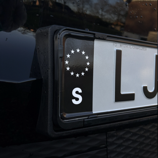 Svart S-märke